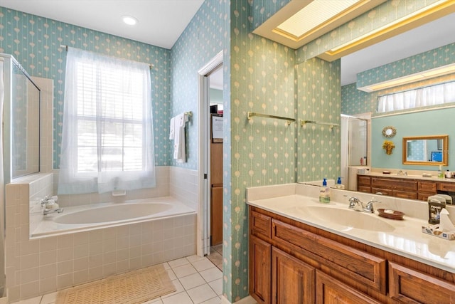 bathroom featuring tile patterned floors, vanity, and independent shower and bath