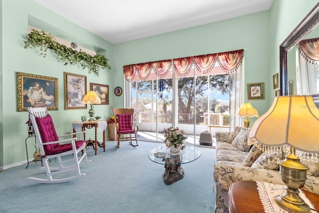 sitting room with a healthy amount of sunlight and carpet flooring