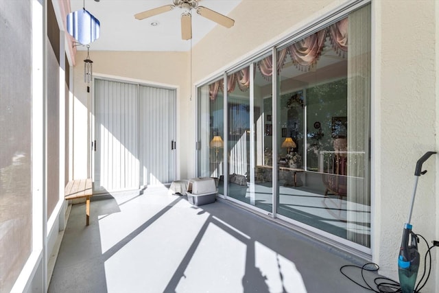 sunroom / solarium with ceiling fan and lofted ceiling