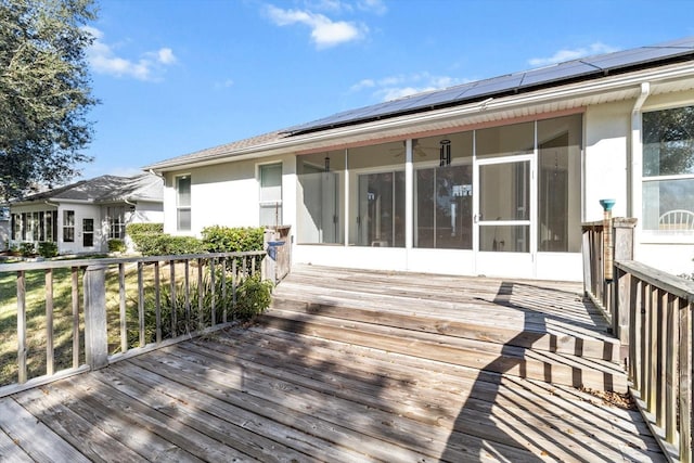 wooden terrace with a sunroom