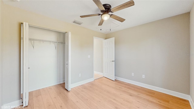 unfurnished bedroom featuring ceiling fan, a closet, and light hardwood / wood-style floors