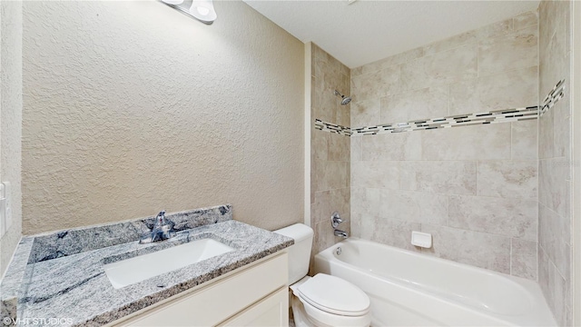 full bathroom with tiled shower / bath combo, vanity, and toilet