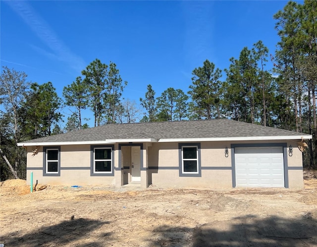 single story home featuring a garage