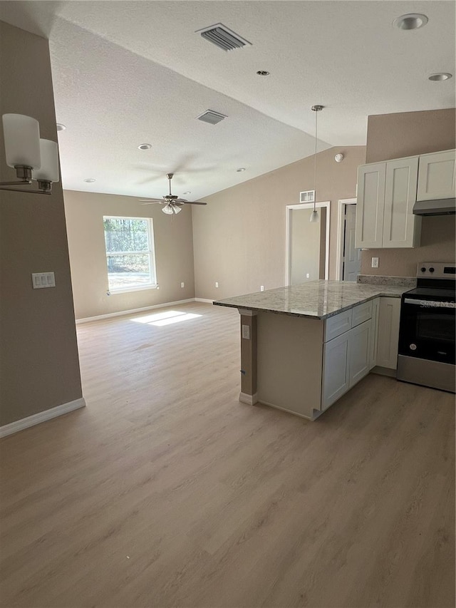 kitchen featuring white cabinetry, light stone counters, stainless steel electric range oven, decorative light fixtures, and light hardwood / wood-style floors