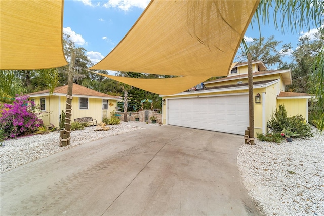 view of property exterior with a detached garage