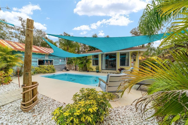 pool with a patio area