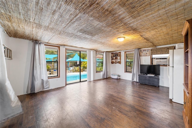 unfurnished living room with wood-type flooring