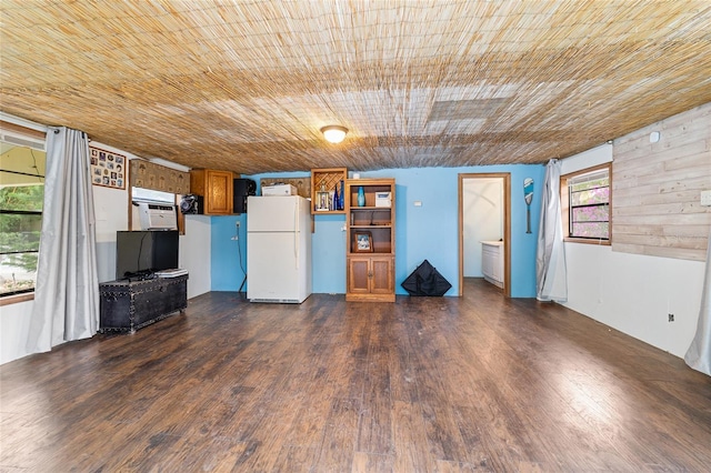 unfurnished living room featuring wooden ceiling and dark wood-type flooring