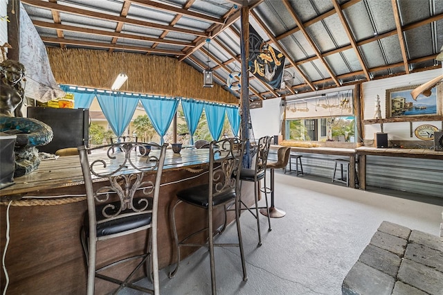 interior space featuring lofted ceiling and carpet