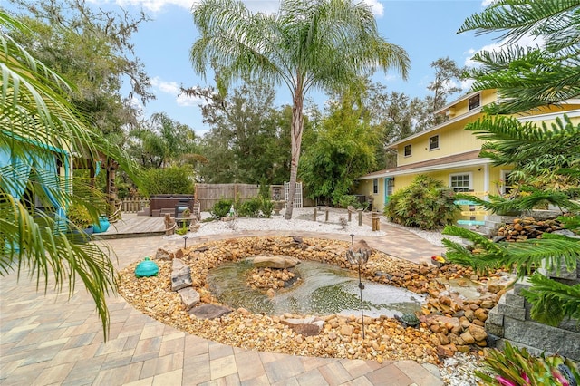 view of yard with a patio, a deck, and fence