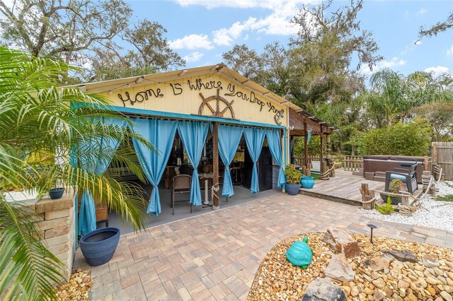 view of outbuilding with a hot tub