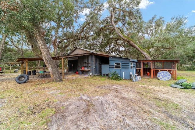 exterior space featuring an outdoor structure and an outbuilding