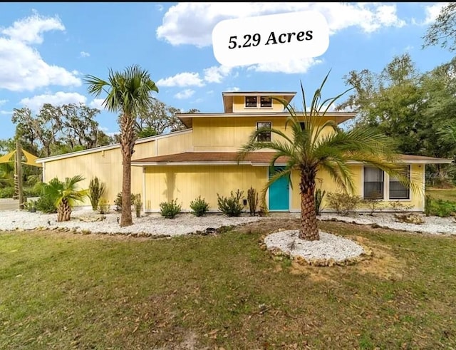 view of front of home with a front yard