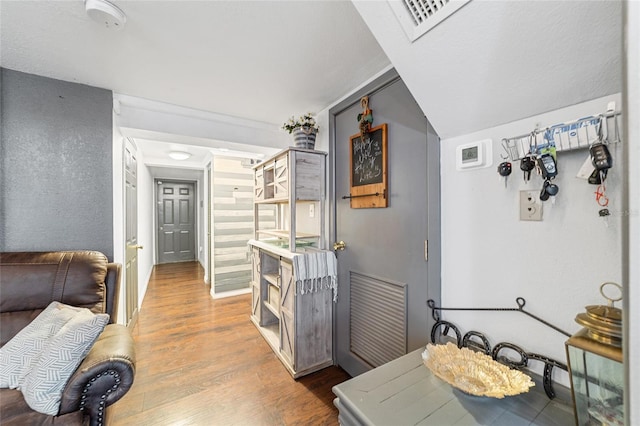 interior space featuring wood finished floors and visible vents