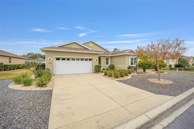 ranch-style home featuring a garage