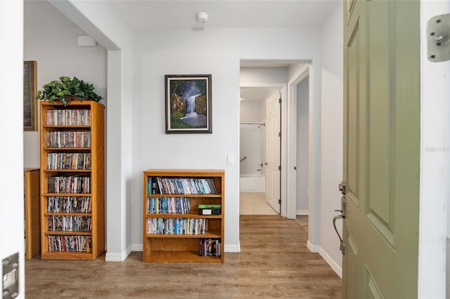 hall with light hardwood / wood-style flooring