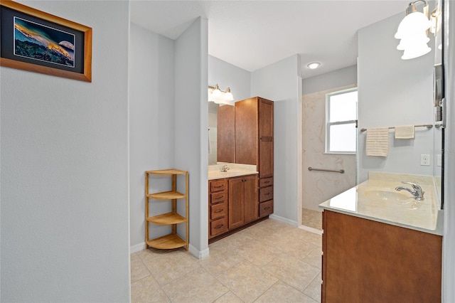 bathroom featuring tile patterned flooring and vanity