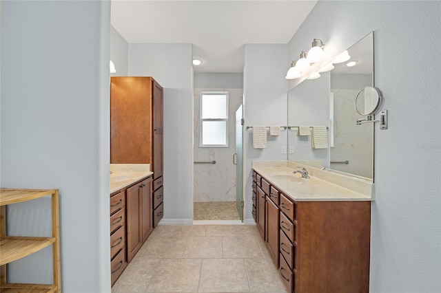 bathroom featuring tile patterned flooring, vanity, and walk in shower