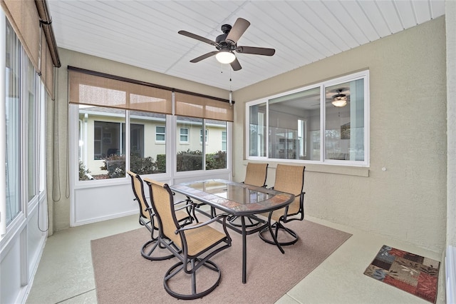 sunroom featuring ceiling fan