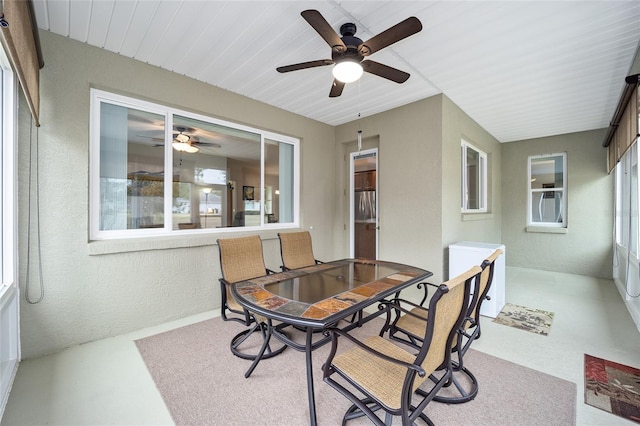 sunroom featuring plenty of natural light and ceiling fan