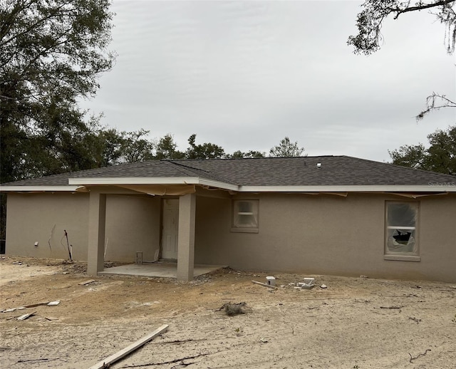 view of side of home with a patio area