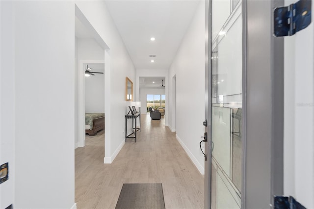 hall with light hardwood / wood-style flooring