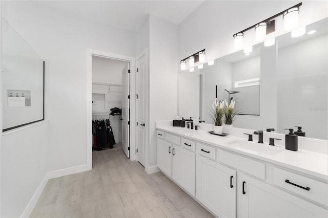 bathroom with hardwood / wood-style flooring and vanity