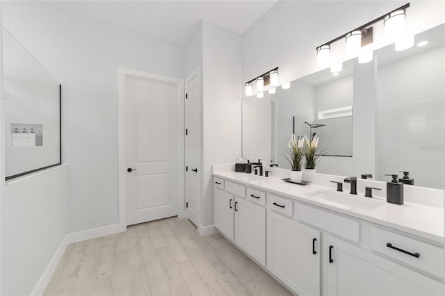 bathroom with wood-type flooring and vanity