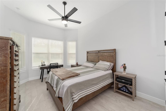 bedroom with light wood-type flooring and ceiling fan