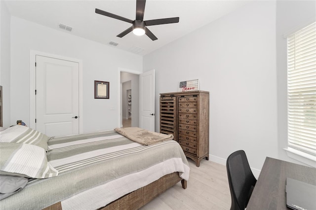 bedroom with ceiling fan and light hardwood / wood-style flooring