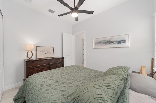 bedroom with ceiling fan and light hardwood / wood-style floors