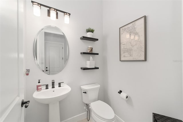 bathroom with sink and toilet