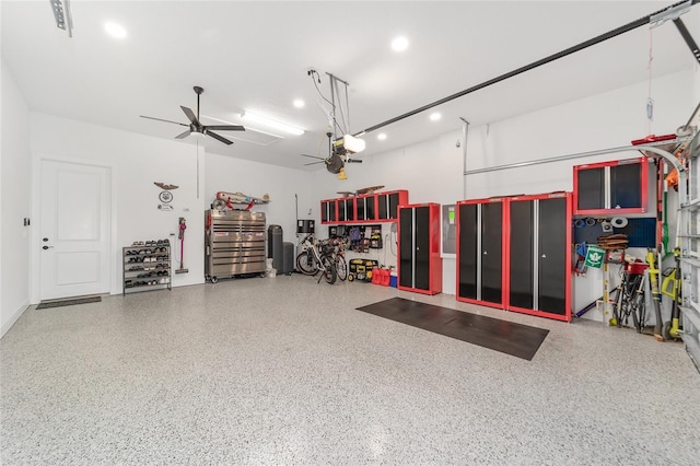 garage with ceiling fan and a garage door opener