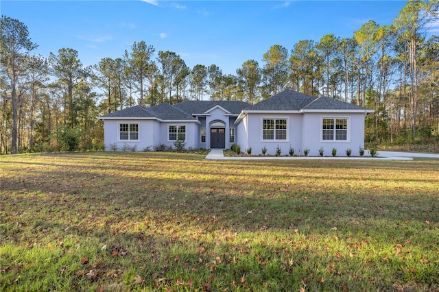 ranch-style home with a front lawn