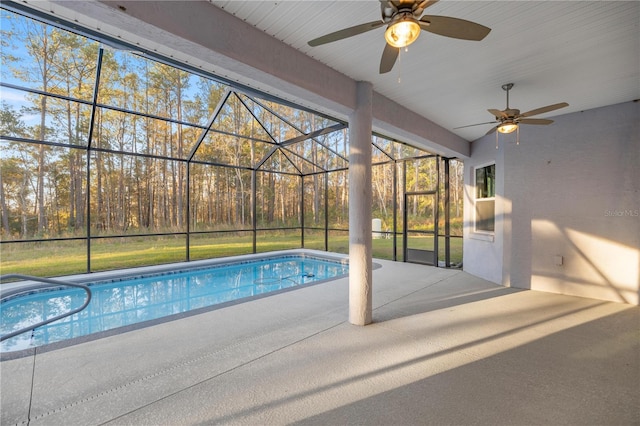 view of pool with a lanai, ceiling fan, and a patio area