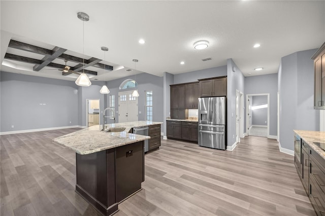 kitchen with beam ceiling, sink, stainless steel appliances, coffered ceiling, and a spacious island