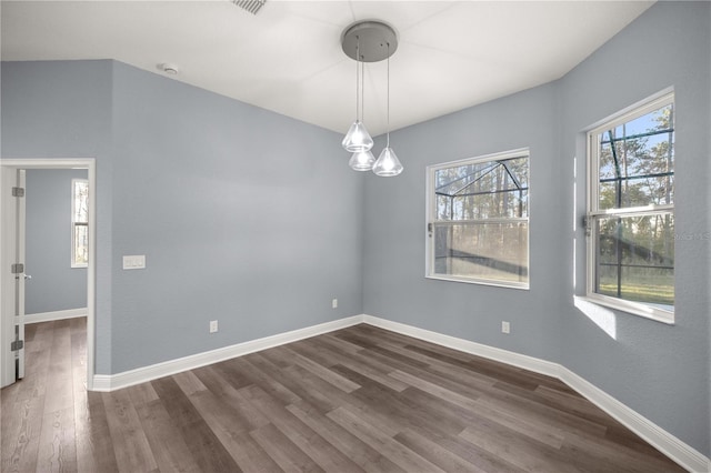 empty room featuring dark wood-type flooring