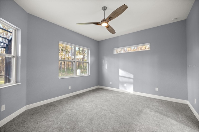 carpeted empty room with ceiling fan