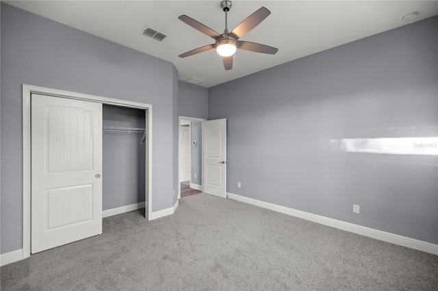 unfurnished bedroom featuring carpet, a closet, and ceiling fan