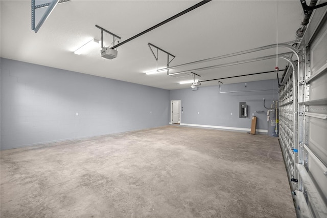 garage featuring electric panel, electric water heater, and a garage door opener