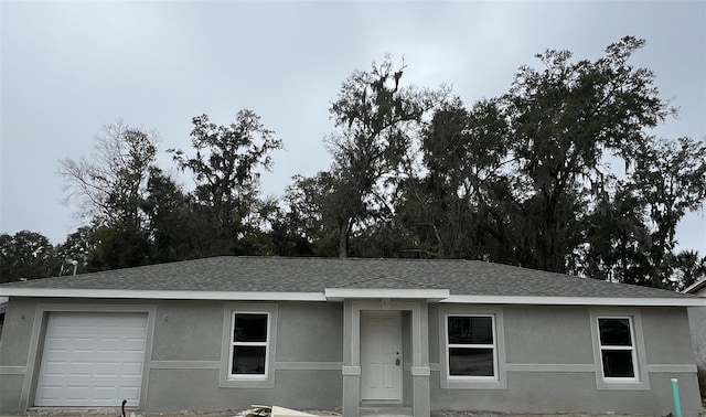 ranch-style home with a garage