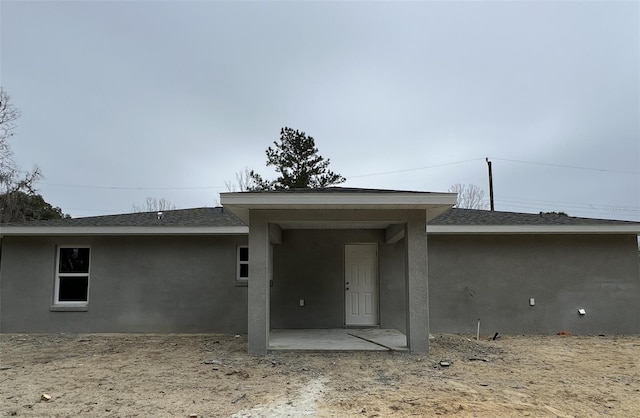 rear view of property featuring a patio