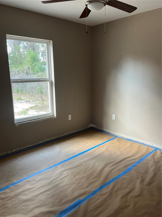 empty room featuring ceiling fan