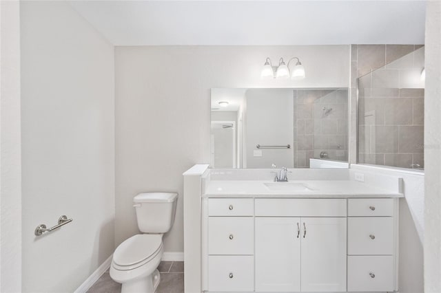 bathroom with tile patterned flooring, toilet, tiled shower, and vanity