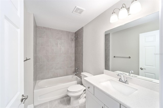 full bathroom with toilet, tiled shower / bath combo, tile patterned floors, and vanity