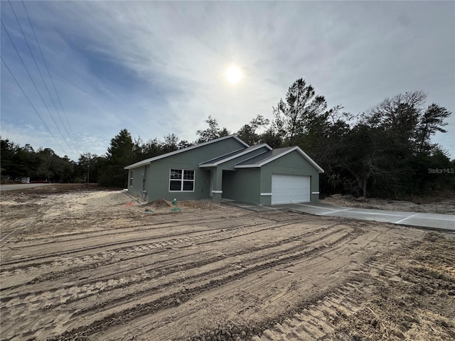 view of front of property with a garage