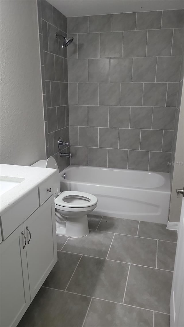 24300 SW Sea Cliff Ave, Dunnellon, FL 34431 - bathroom with vanity, bathtub / shower combination, tile patterned floors, and a textured wall