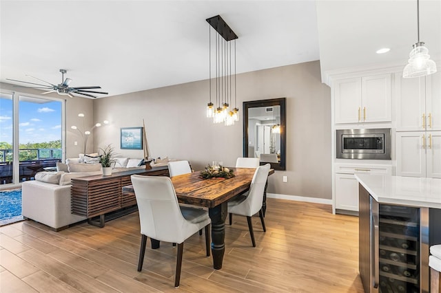 dining space with beverage cooler and ceiling fan