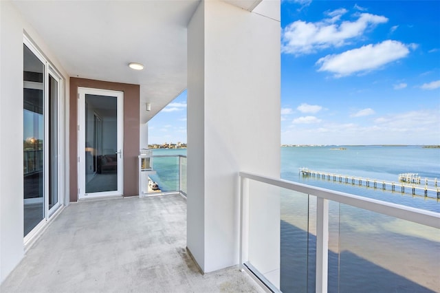 balcony featuring a water view