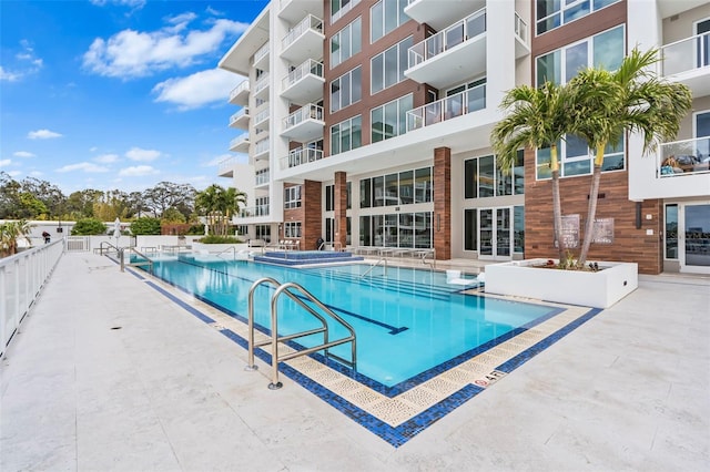 view of pool featuring a patio area